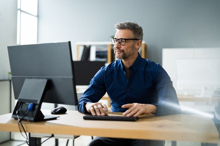 A person utilizing the AI PDF reader to analyze his paper.