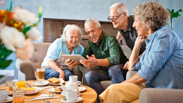 Elders sharing their restored old photos using the AI photo restoration software.