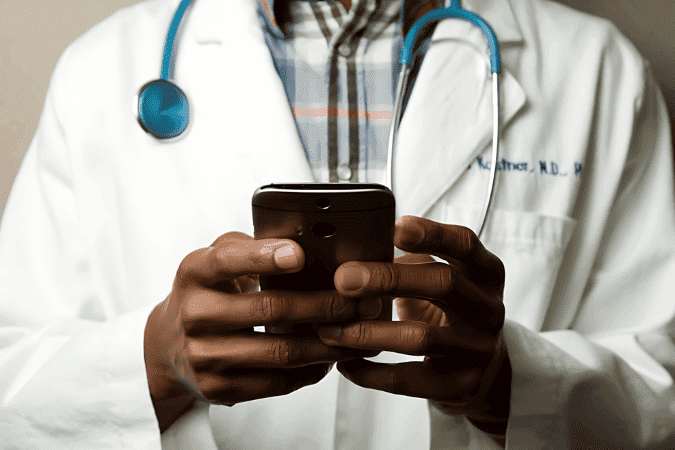 doctor using a smartphone, demonstrating AI advantage and artificial intelligence in healthcare