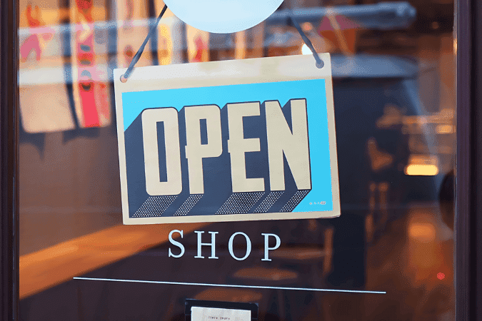 open shop sign, illustrating AI advantage and artificial intelligence in retail